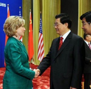 Chinese President Hu Jintao greets U.S. Secretary of State Hillary Clinton at Monday's opening of the S&ED