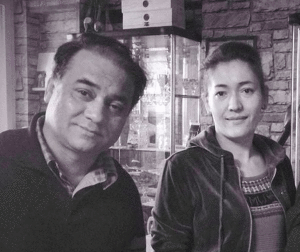 Ilham Tohti and his wife before he was sentenced to life imprisonment